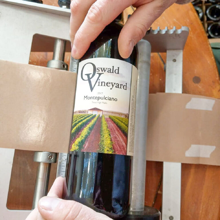 Labeling 2017 Vintage - Rolling the label on the bottle.