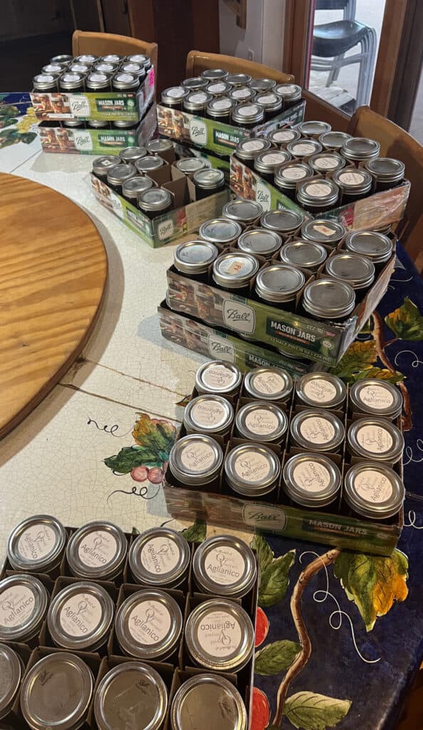 Jars of Oswald Vineyard Jelly stacked on the kitchen table